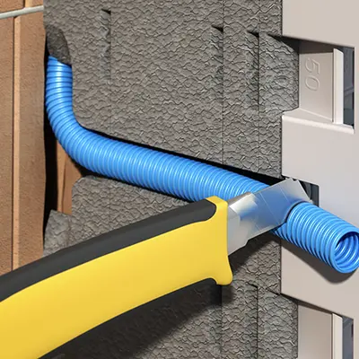 Press the conduit into the side guide and cut it to length.