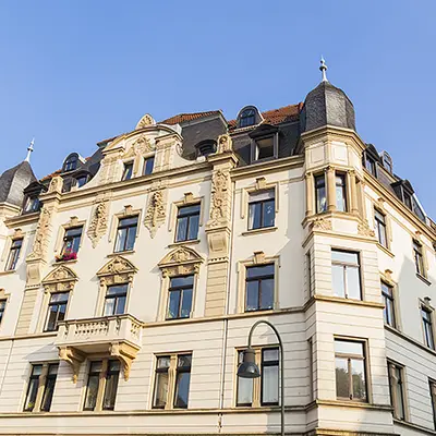 Historically significant facades in exposed masonry or stucco facades.