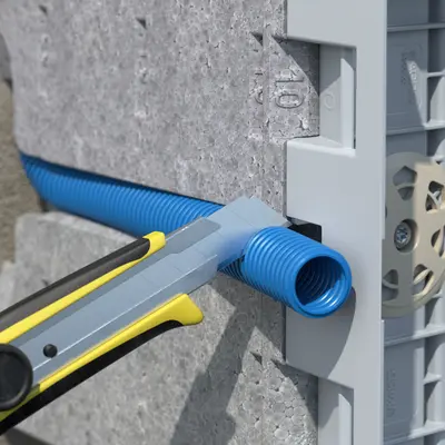 Press the conduit into the sideway guide and cut it to length.