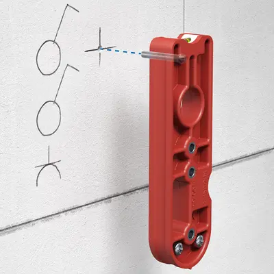 Position and secure the drilling template by inserting the guide pin.