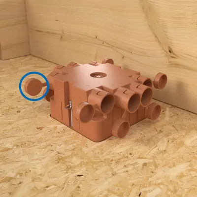 Before installation, cut off the positioning element. Then insert the AGRO flush-mounted junction box into the properly dimensioned hole ...