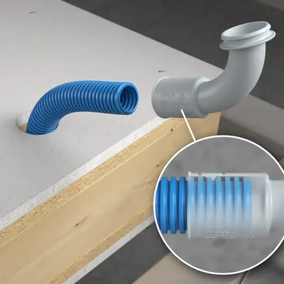 Le conduit d'installation électrique en saillie est introduit dans le logement du conduit du coude à 90° jusqu'à la butée de profondeur et enclenché.