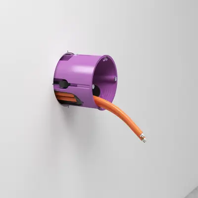 Lors de l'installation de la boîte, poser les câbles de l'extérieur dans la membrane afin de pouvoir guider la boîte dans l'orifice d'encastrement.