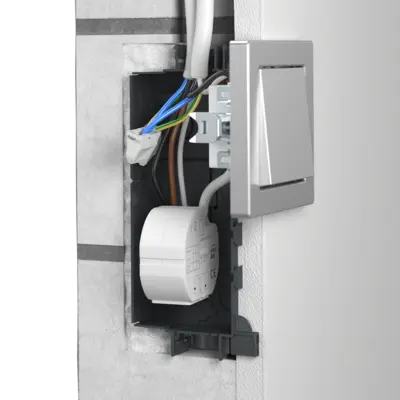 Here for example is a relay for central control of several roller blind drives or a flush mounting EIB interface with a conventional button.