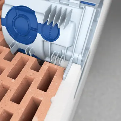 The plaster penetrates between the box and the stone, ensuring that the box is securely and permanently fixed.