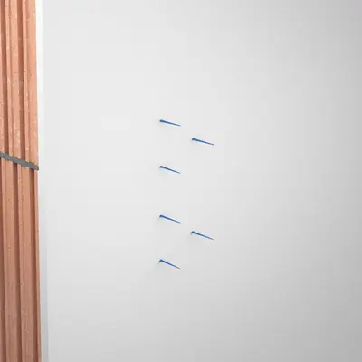 After plastering, the signal bristles indicate the position of the boxes.